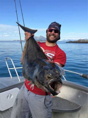 Happy fisher with nice halibut