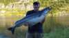 Happy fisher with big pollock